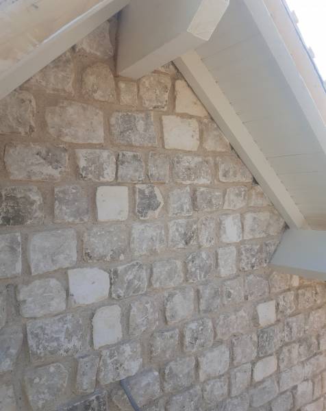 réalisation d'un agrandissement avec pose de moellon avec joint chaux ciment au Neubourg 27